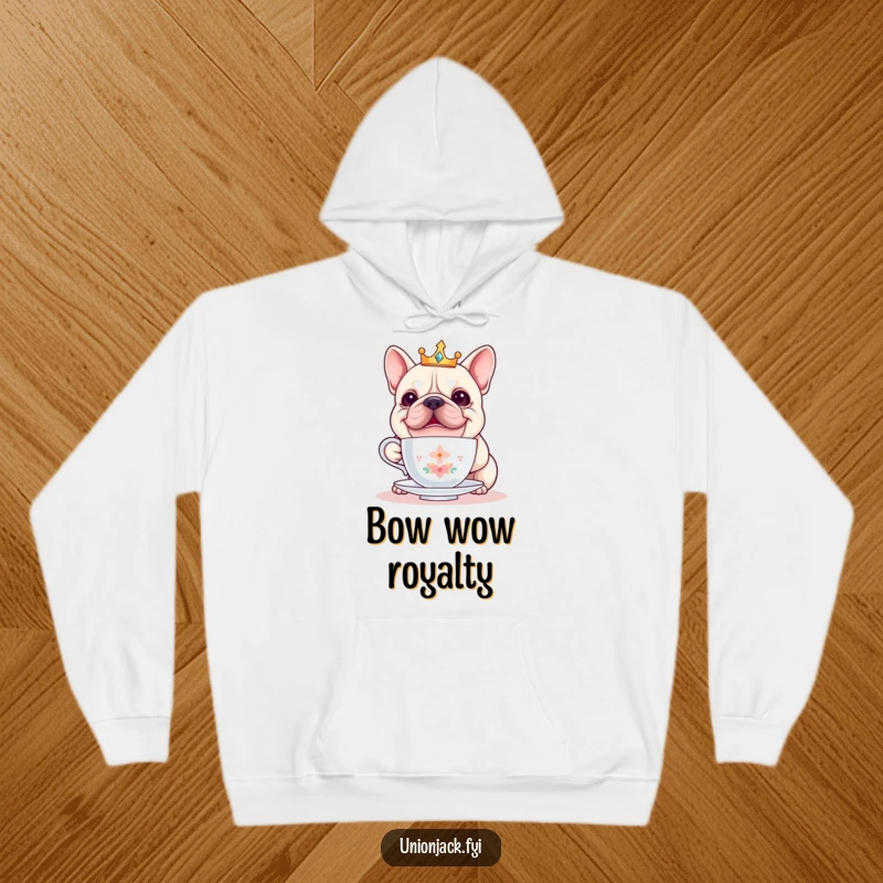 Funny bulldog hoodie displays a cheerful, crowned bulldog attempting to balance a teacup, radiating comical regal vibes.
