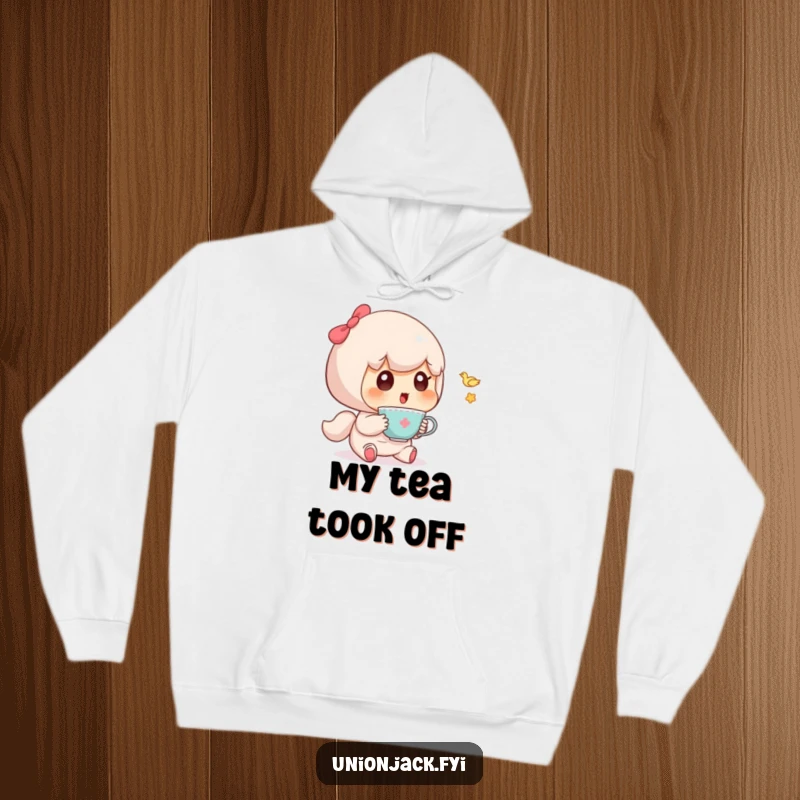 Funny hoodie depicting a cute character with a look of pure surprise at a tiny, airborne teacup.